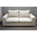 Heals; a Moretta medium seat sofa upholstered in cream fabric on block feet, 195cm wide x 75cm high.