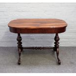 A Victorian rosewood writing table,