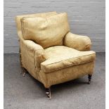 George Smith; a 20th century easy armchair with patterned loose upholstery and turned supports,