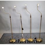 A group of four 20th century brass floor standing angle poise lamps, each 148cm high, (4).