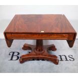 A 19th century mahogany drop flap sofa table with turned column and quatrefoil base,
