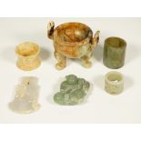 A group of Chinese jades, various colours, comprising; an archaistic axe pendant, 9cm.