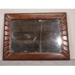 A 20th century leather framed rectangular wall mirror, 118cm wide x 86cm high.