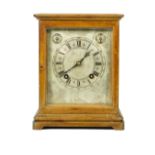 An early 20th century mahogany cased mantel clock,