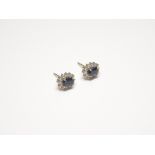 A pair of 18ct yellow and white gold, sapphire and diamond oval cluster earstuds,