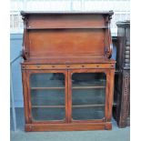 A 19th century mahogany side cabinet, the scroll mounted shelf back over a pair of glazed doors,