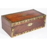 An early 19th century brass inlaid mahogany writing slope with fitted interior,