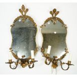 A pair of Victorian style shaped glass wall mirrors, early 20th century,