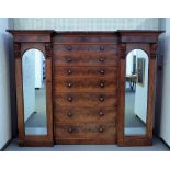 A Victorian mahogany sentry wardrobe with seven long graduated central drawers flanked by hanging