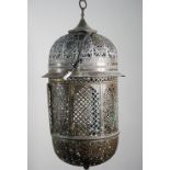 A pierced brass wall lantern, early 20th century, of Moroccan style with domed top and bottom,