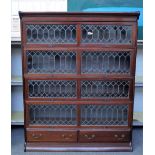 A Globe Wernicke style mahogany double bookcase with four up and over doors over a pair of drawers