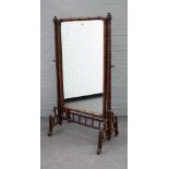 A late 19th century French faux bamboo cheval mirror with rounded rectangular mirror plate and