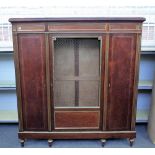 An early 20th century French Directoire style brass mounted mahogany side cabinet with central