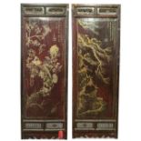 A pair of Chinese framed rectangular panels, gilt decorated with birds and hares amongst foliage,