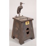 A 20th century Arts & Crafts style cigarette dispenser with heron mounted finial,