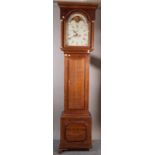 An 18th century 8 day oak longcase clock with arch top 13 inch dial,