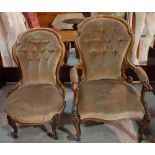 A Victorian walnut framed upholstered armchair and a matching lady's armchair,