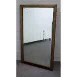 A 19th century rectangular mirror with reeded brass veneered frame, 85cm wide x 147cm high.