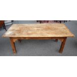 A 19th century kitchen table, the cleated sycamore triple plank top on square fruitwood supports,