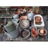 A pair of 20th century terracotta plant pots with swag decoration, 36cm wide x 25cm high,