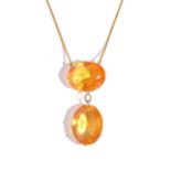 A gold and citrine two stone pendant necklace, claw set with two oval cut citrines,