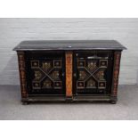 A Victorian Gothic revival ebonised and polychrome painted side cabinet with pair of geometric