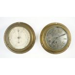A Negretti and Zambra ships brass cased port hole wall clock,