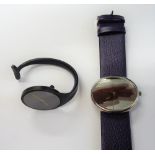 A Georg Jensen lady's bangle watch, having a blackened finish, the plain black dial with gilt hands,