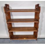 An early 20th century oak four tier hanging shelf, 56cm wide x 72cm high.