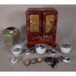 Asian collectables, including; a red leather miniature jewellery box, 20cm wide x 27cm high,