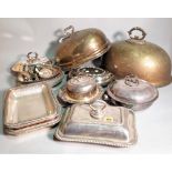 Silver plated wares; a group of tureens, covers and handles.