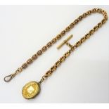 A Victorian gold watch Albert chain, in a shaped rectangular and star pierced link design,