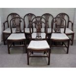 A set of eight Hepplewhite design mahogany arch back dining chairs, on canted square supports,