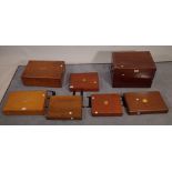 A group of seven mahogany/ oak cutlery boxes of various sizes, the largest 47cm wide x 30cm high,