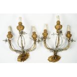 A pair of Louis XVI style giltwood and wrought iron three branch wall appliques,