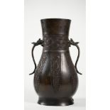 A Chinese archaistic bronze two-handled vase, Xuande six character mark, but 18th/19th century,