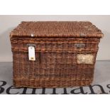 An early 20th century wicker and canvas lined lift top trunk, 79cm wide x 53cm high.