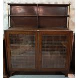 A late Victorian mahogany and brass mounted chiffonier with glazed panelled doors on bracket feet,