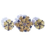 An 18ct gold and sapphire brooch, designed as a hexagonal wreath, having a textured finish,