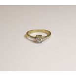 A gold and diamond single stone ring,