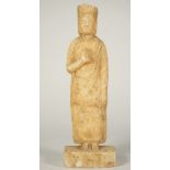 A Chinese Tang-style marble figure of an attendant,