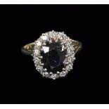 A sapphire and diamond cluster ring, the