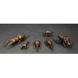 A group of six small Japanese bronze or copper models of varying types of beetle, 20th century,