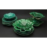 A collection of ten Wedgwood green glazed cabbage leaf moulded plates, dishes and a comport,