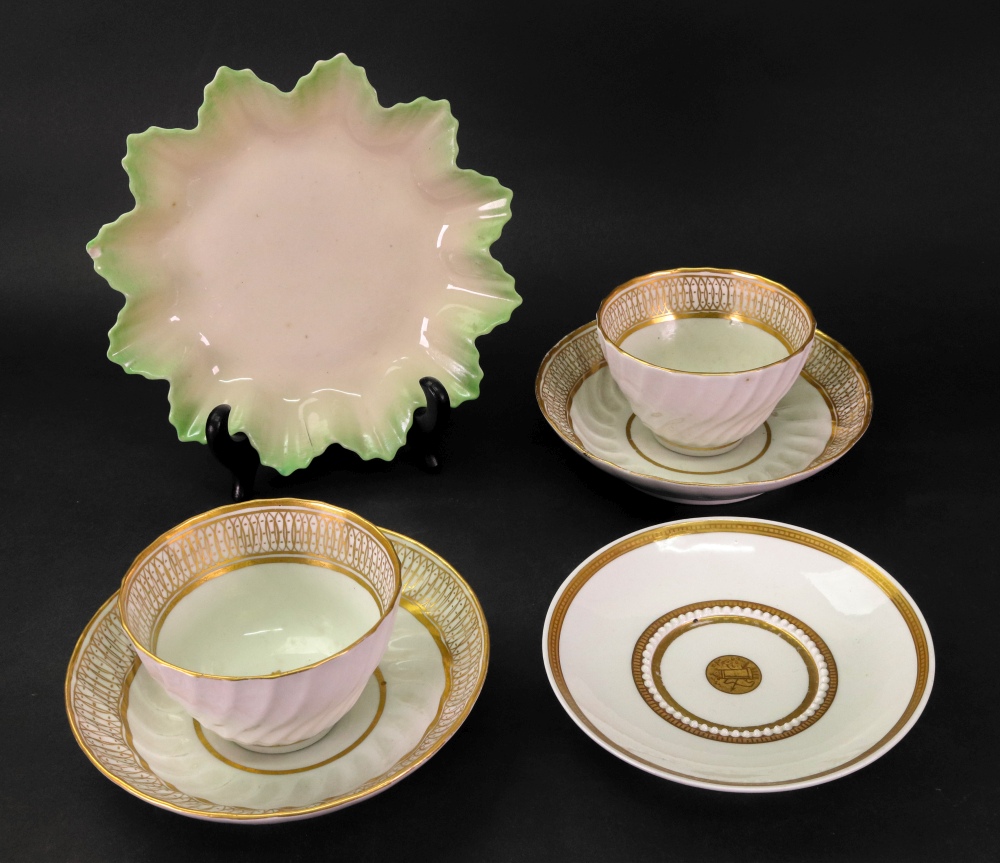 A pair of English tea bowls and saucers