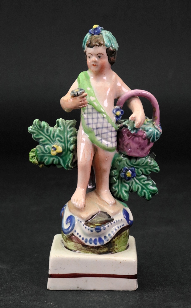 A Staffordshire pearlware figure of a pu