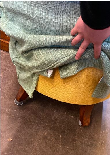 A Victorian button down upholstered armchair, on turned legs, with green loose cover. - Image 3 of 3