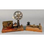 A brass Morse Code machine tapper, labelled A W Gamage Ltd, Holborn, E.C.I, on wooden base, 14.