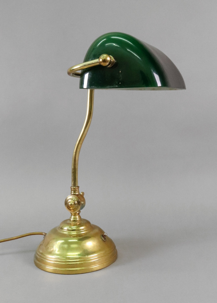 A student's reproduction brass adjustable desk lamp with green glass shade, 43cm high.