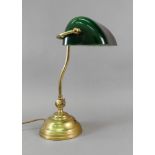 A student's reproduction brass adjustable desk lamp with green glass shade, 43cm high.